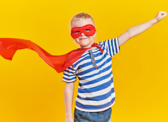 boy with a red mask and cape