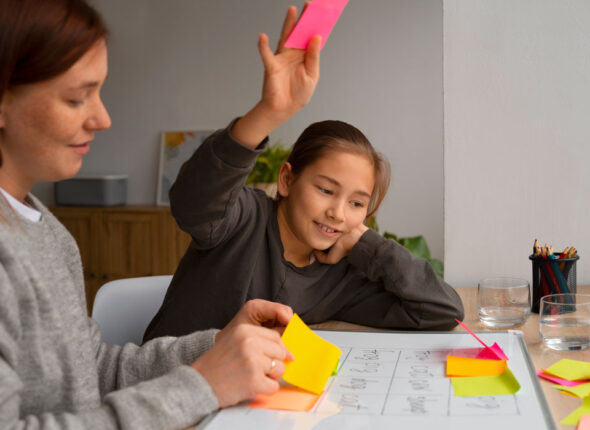 tutor using post-it notes with student
