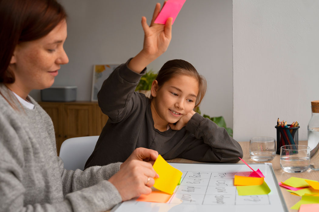tutor using post-it notes with student